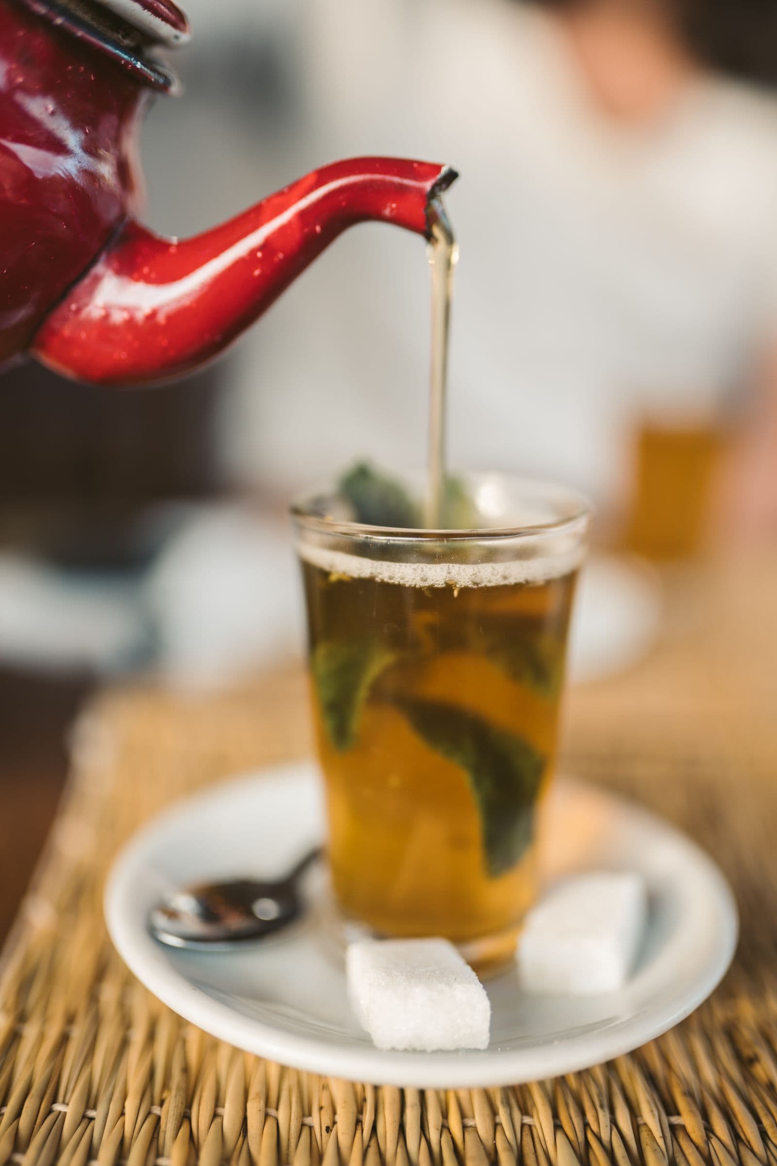 Moroccan mint tea being poured into a glass