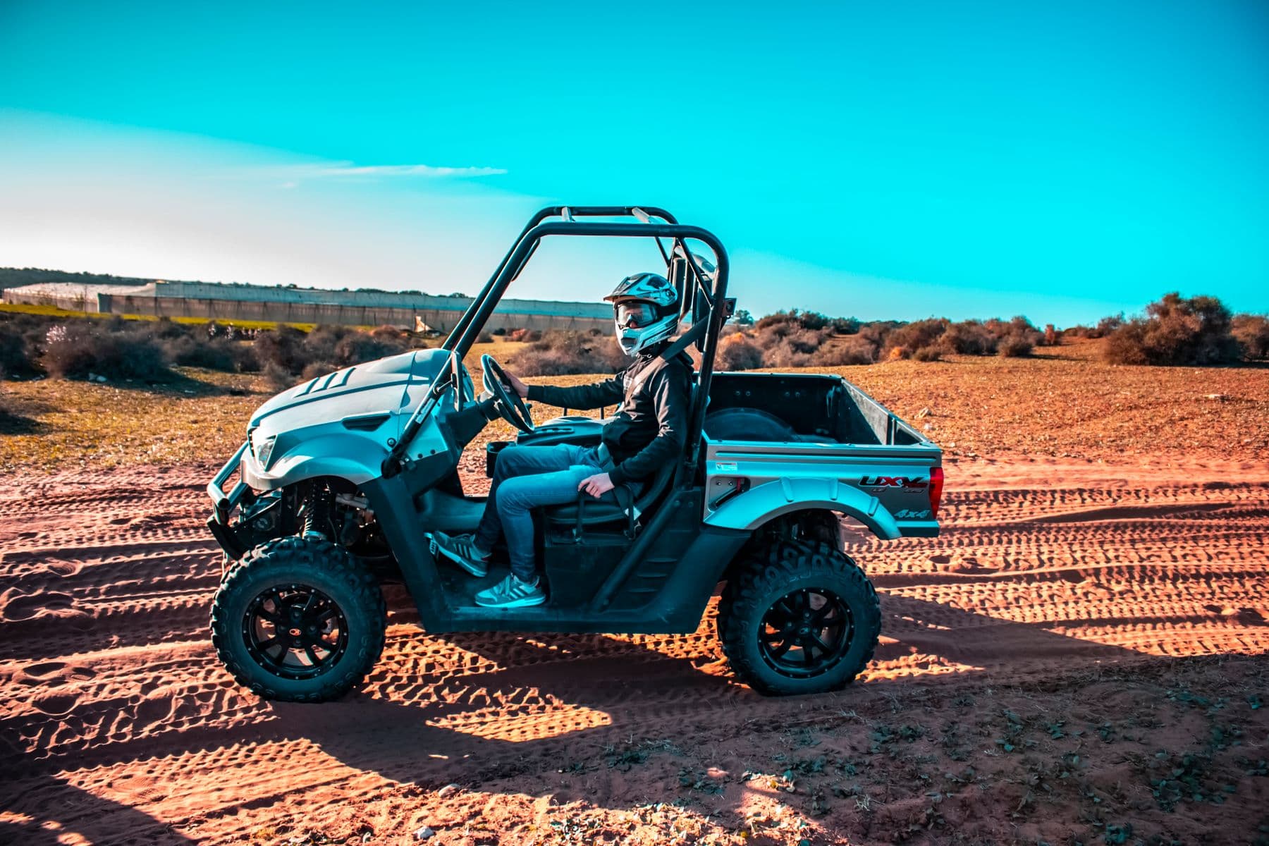 Helmeted driver seated in an off-road buggy in Morocco